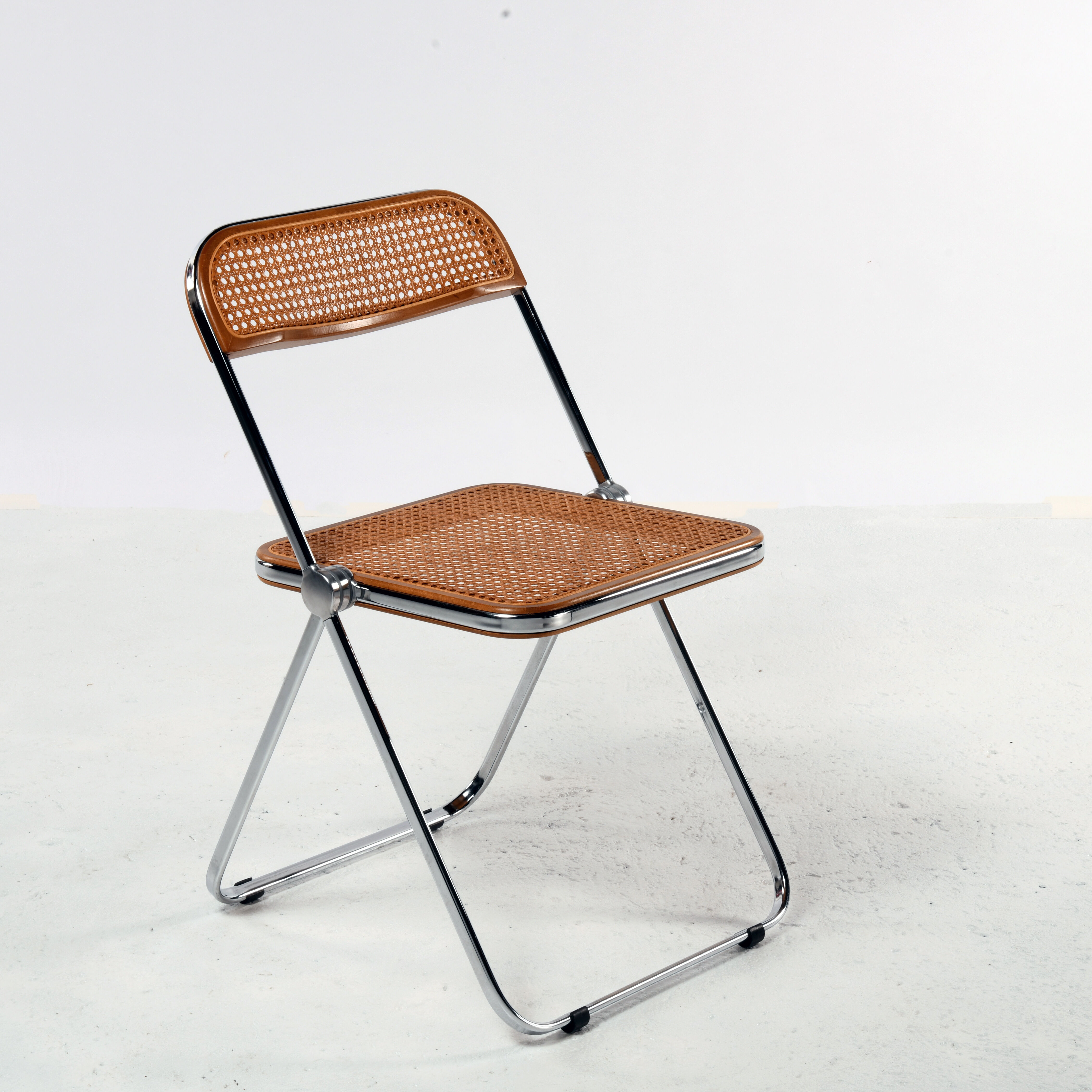 Plia cane chair Giancarlo Piretti Castelli