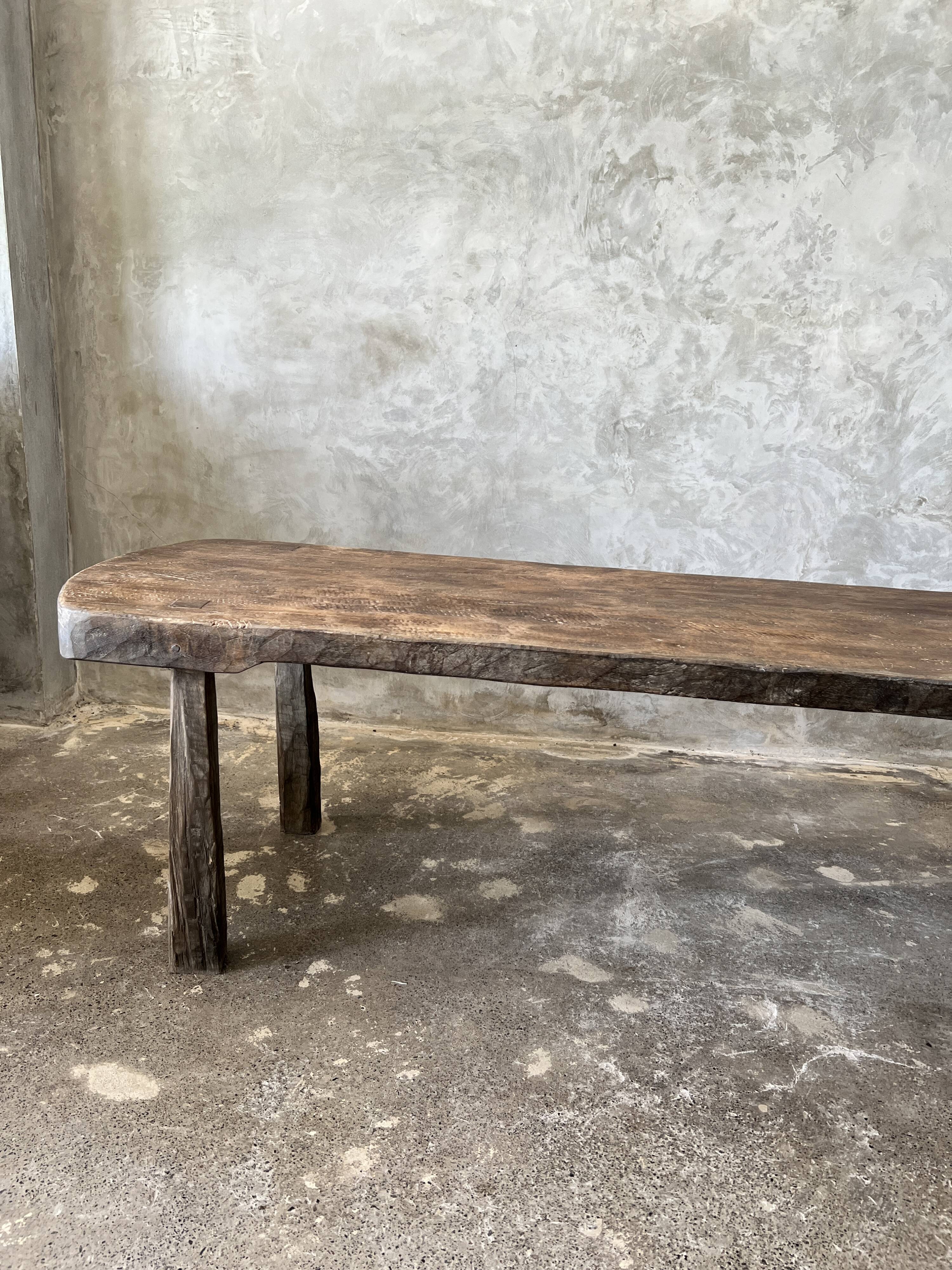 Large rounded coffee table in old Asian teak