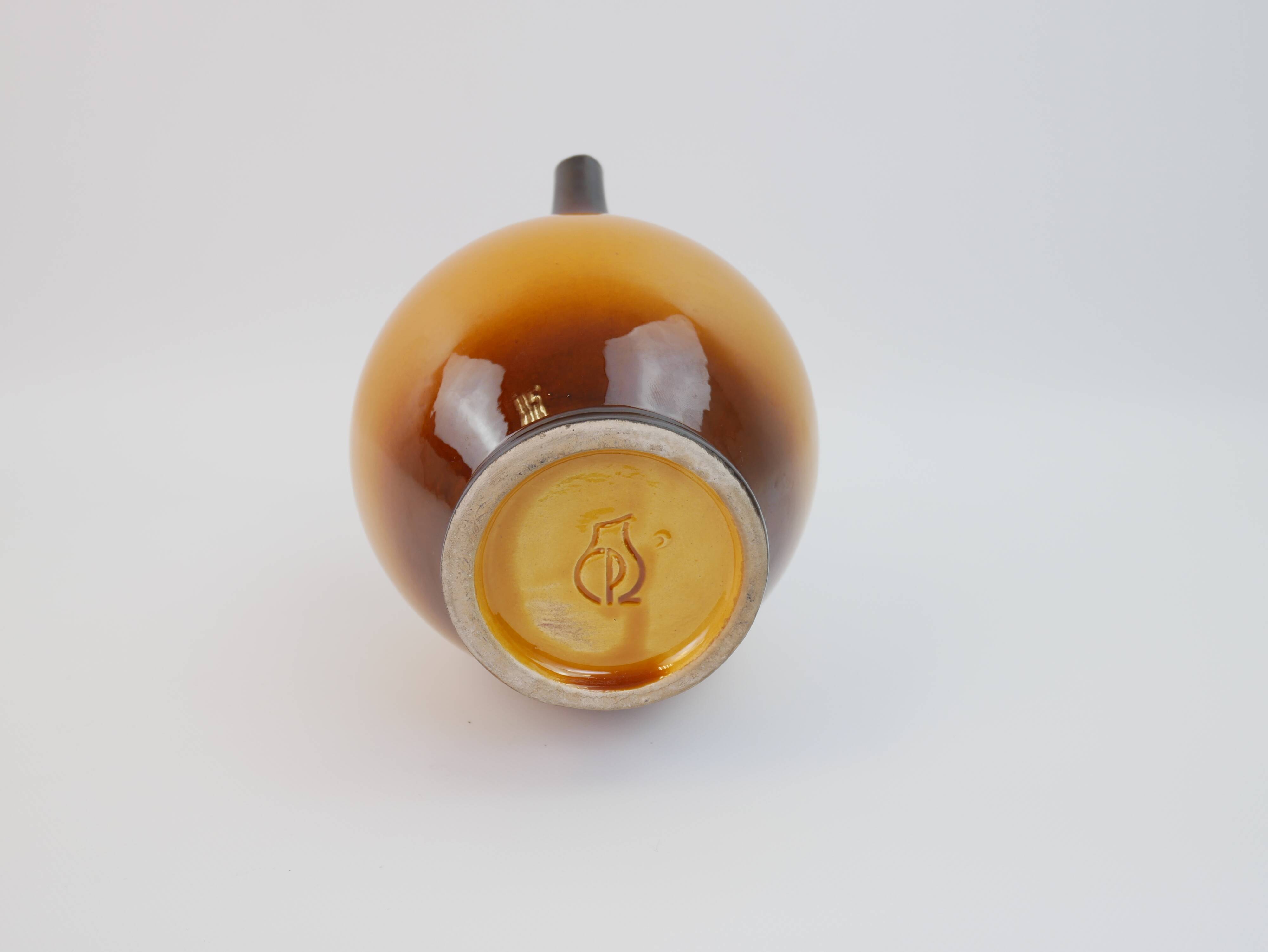 Ochre-orange ceramic jug signed under the base CP Claude Paci