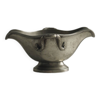 Old gravy boat in silver metal.