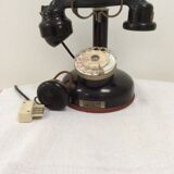 Old Bakelite telephone with column