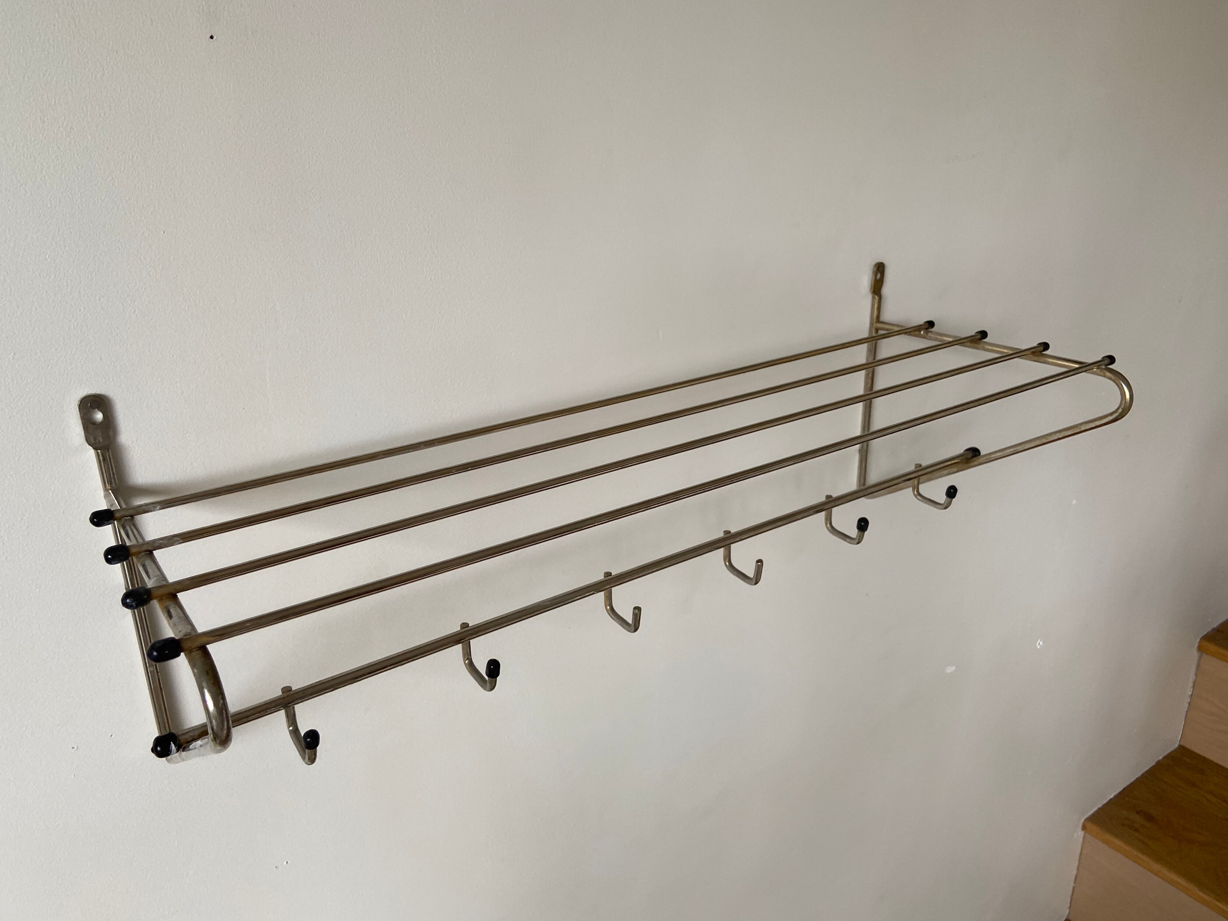 Metal wall coat holder with tablet