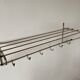 Metal wall coat holder with tablet