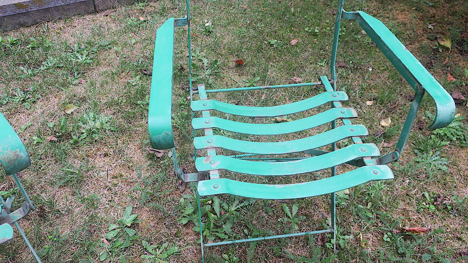 Pair of mid century distressed painted iron garden chairs