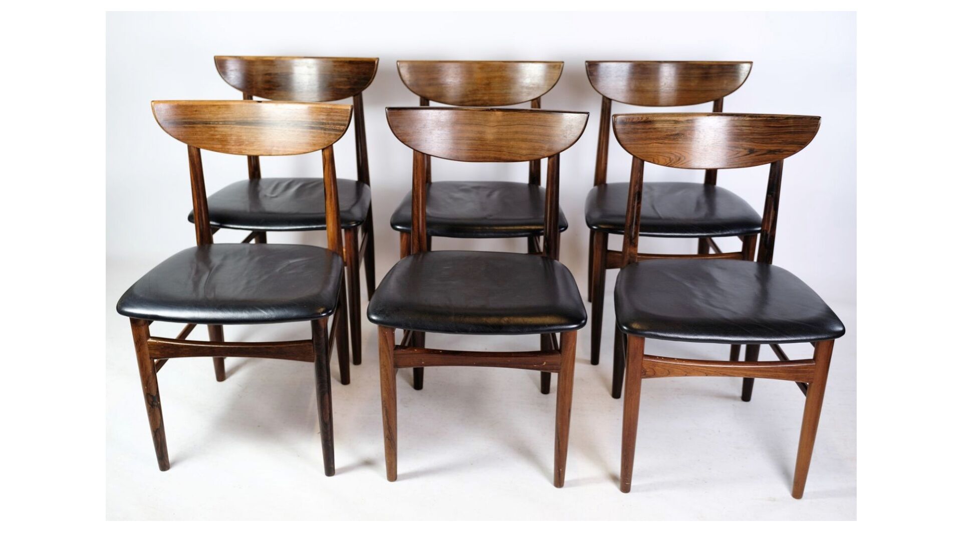 Set of Six Dining Table Chairs of Danish Design in Rosewood with Black Leather