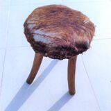 Rustic tripod stool seat covered with goatskin