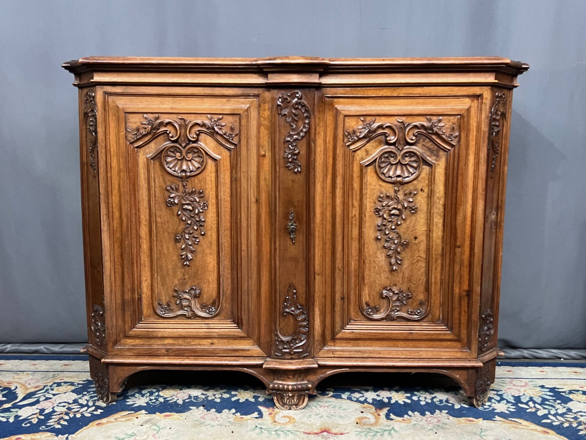 Louis XV style carved walnut chest of drawers