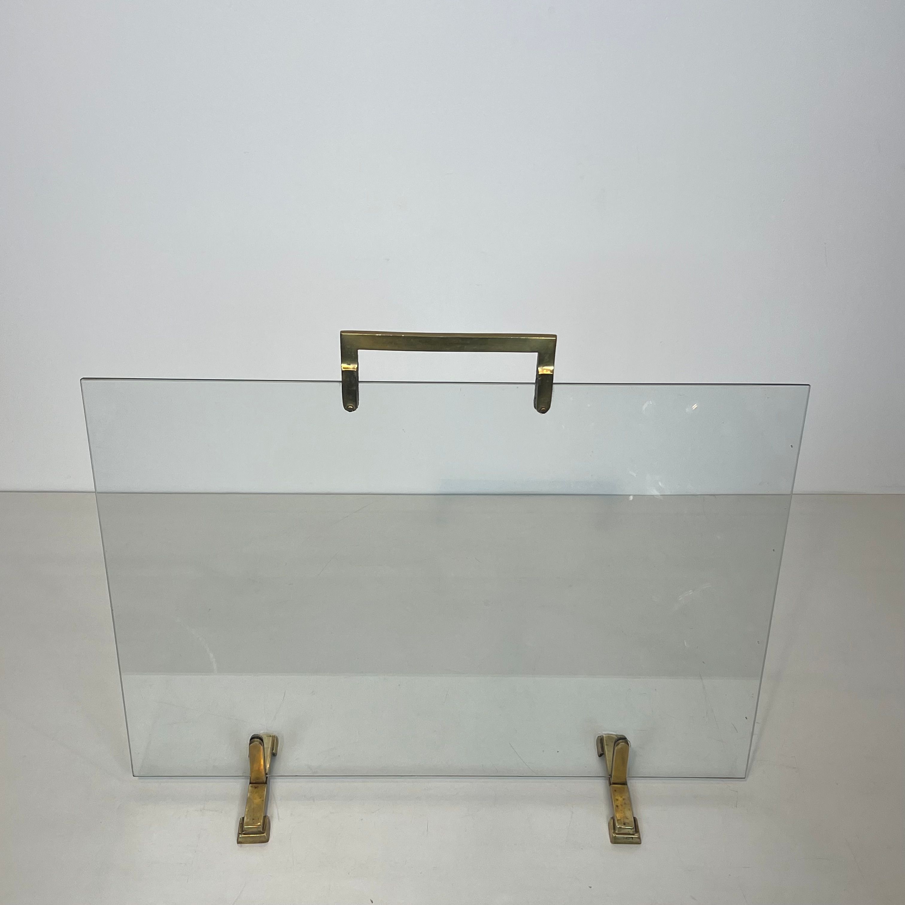 Glass and brass fire screen