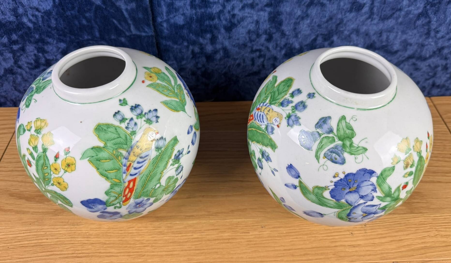 China circa 1900: pair of porcelain ball vases with birds and flowers