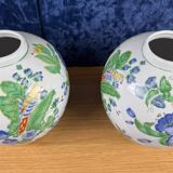 China circa 1900: pair of porcelain ball vases with birds and flowers