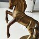 of greenhouse art deco bookends recancing unicorns. solid brass