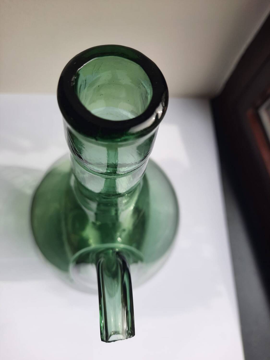Pair of blown glass wine decanters in blue/green hues.