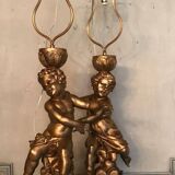 Deux enfants en bois sculpté doré, lampes de table