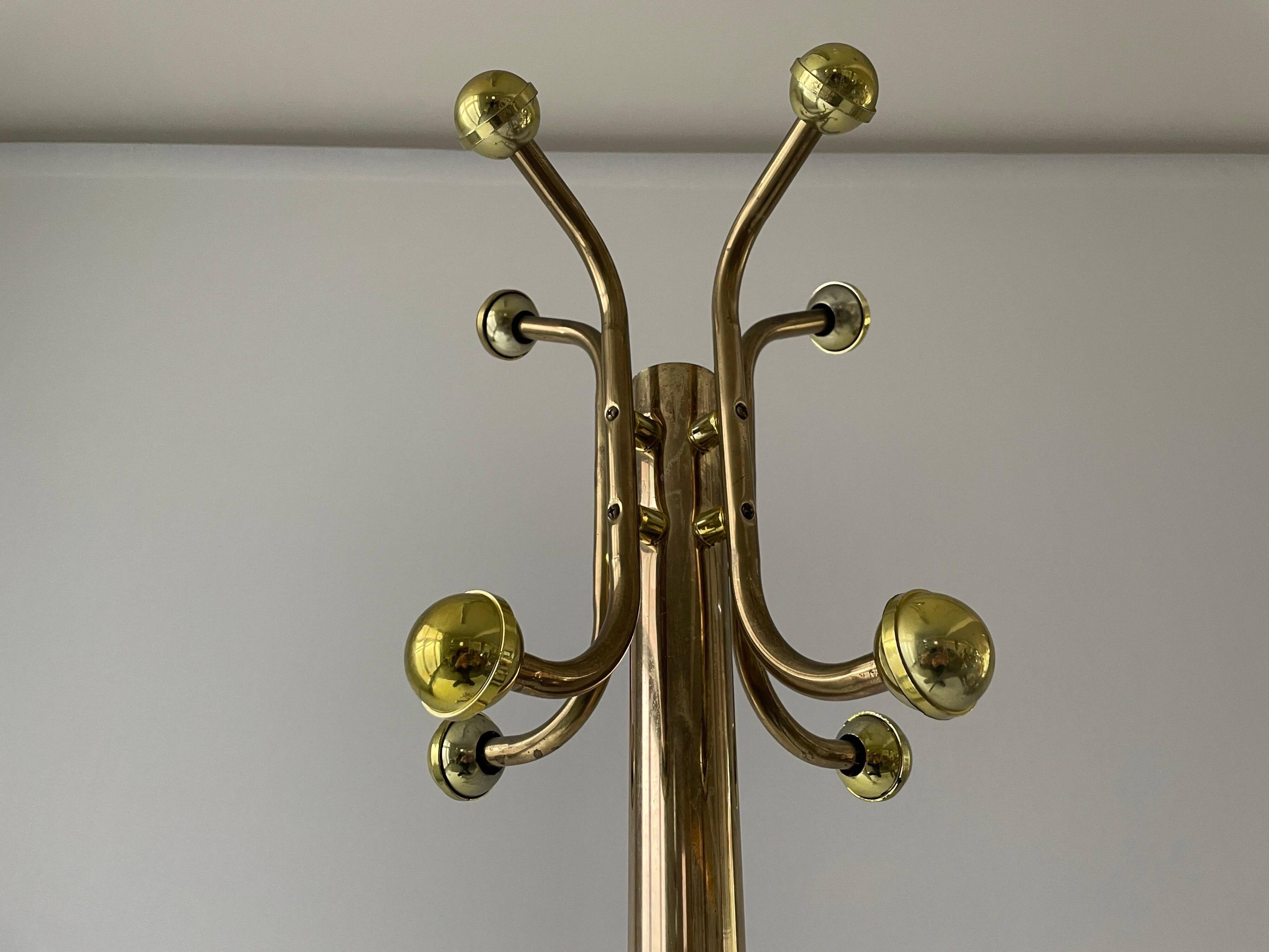 Free-standing coat rack in plexiglass with a marble base, 1960s, Germany.