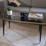 Vintage coffee table with tapered legs.