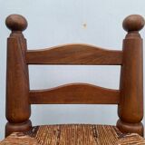 Pair of antique low fire chairs made of wood and straw