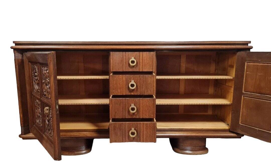 According to Charles Dudouyt: sideboard in a row in solid oak.