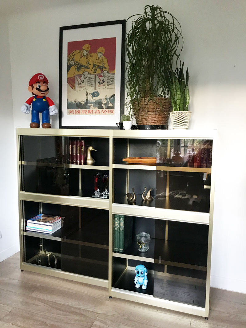 Shelves of black and gold windows