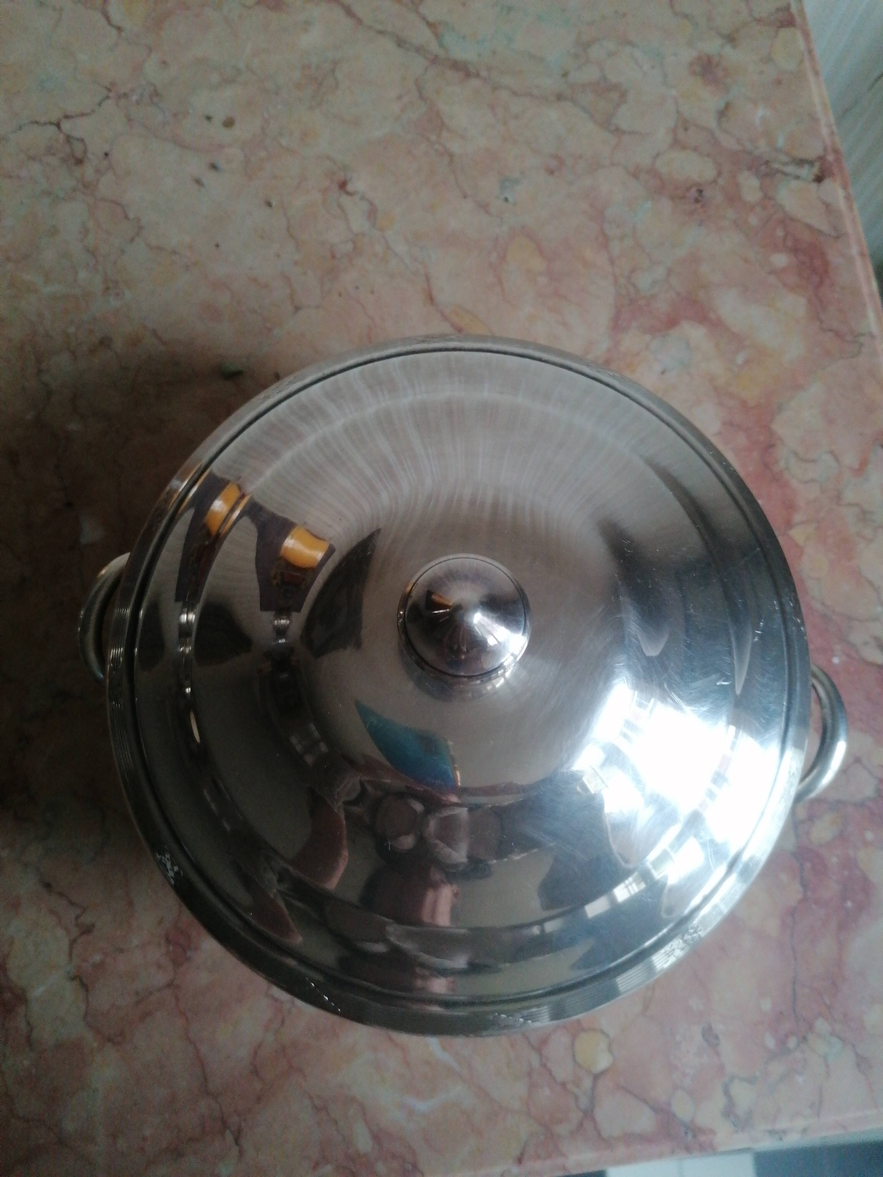 silver metal vegetable dish with crossed ribbon decoration