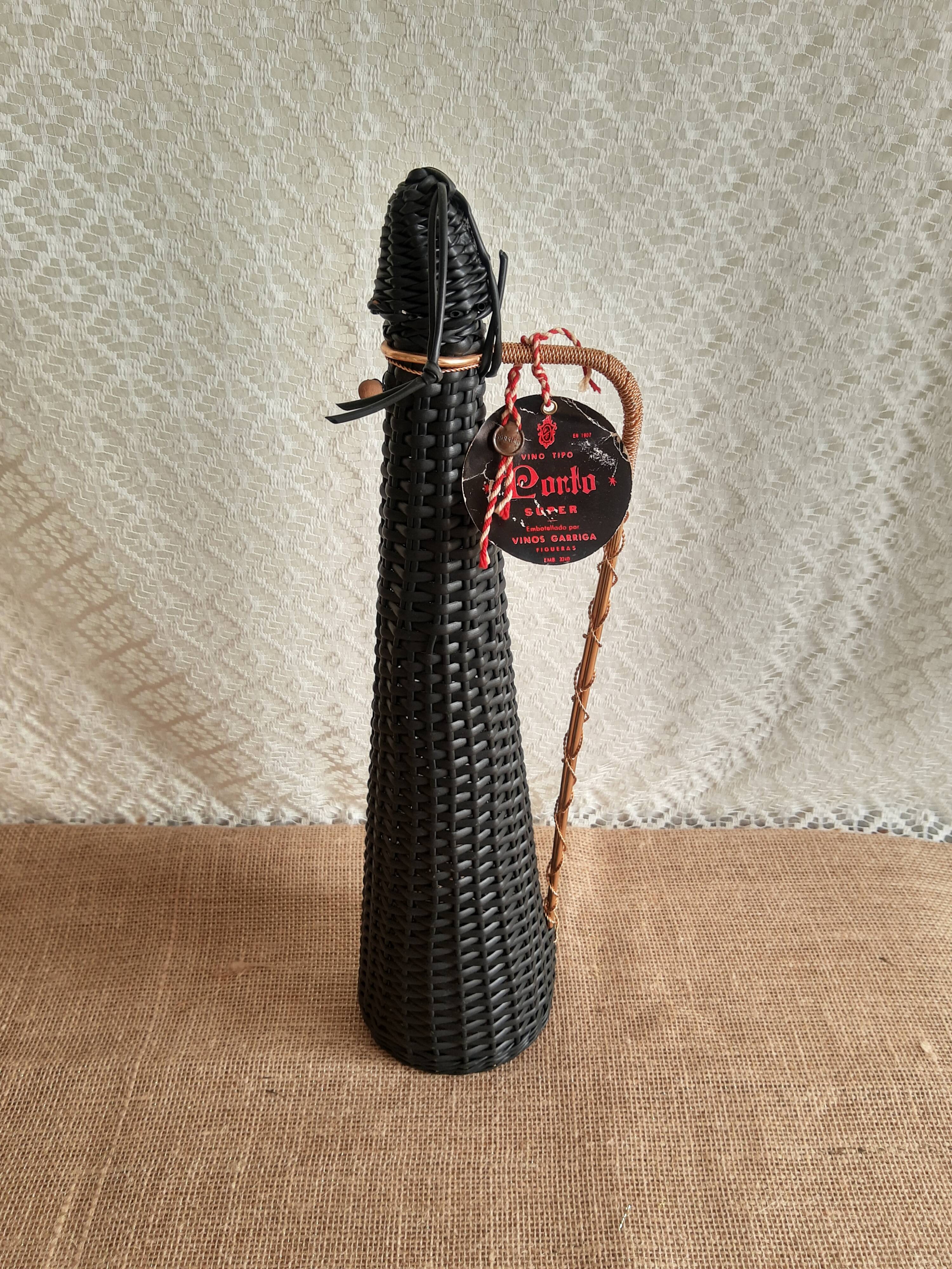 Glass bottle covered with black scoubidou with twisted golden handle - vintage