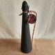 Glass bottle covered with black scoubidou with twisted golden handle - vintage