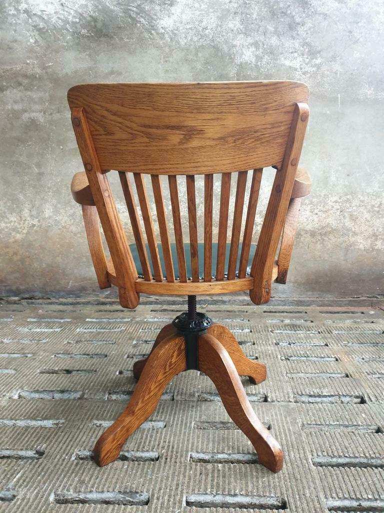 Antique office chair oak adjustable with green leather