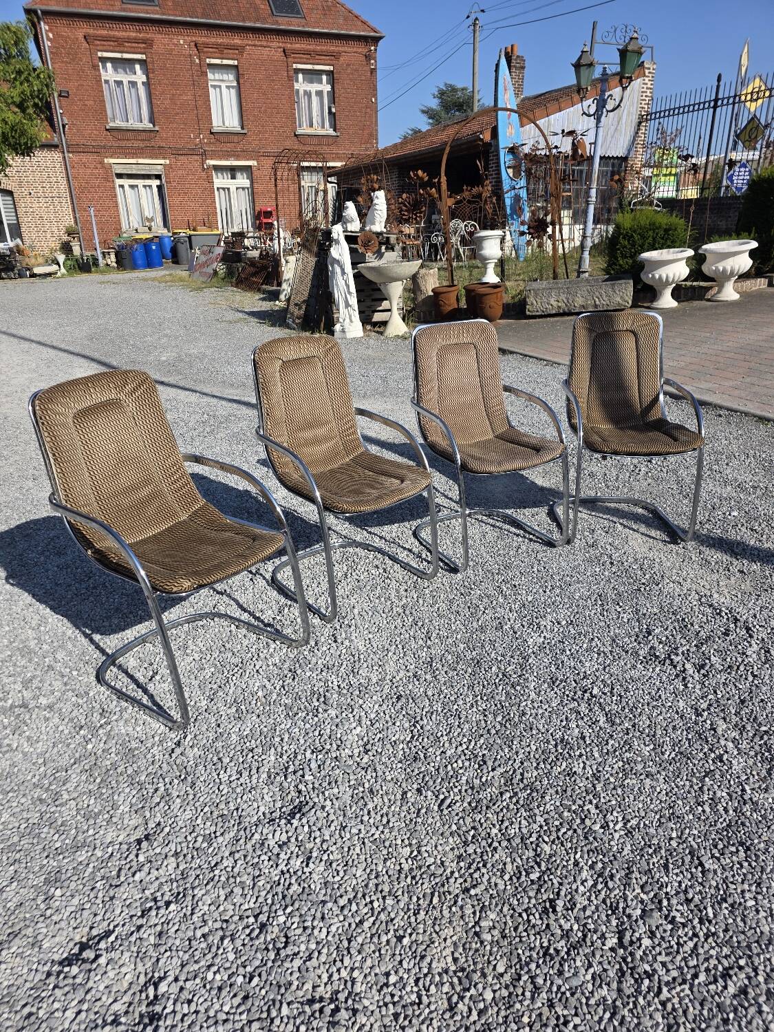 4 chaises Cidue en métal chromé, années 70