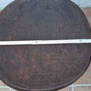 African monoxyle side table in carved wood with a curved top, 48x36 cm.