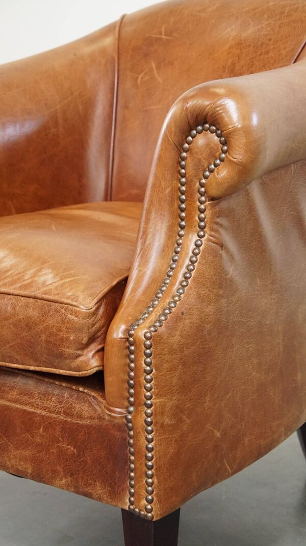 Fauteuil club en cuir très confortable et élégant avec coussin d'assise amovible et design intemporel