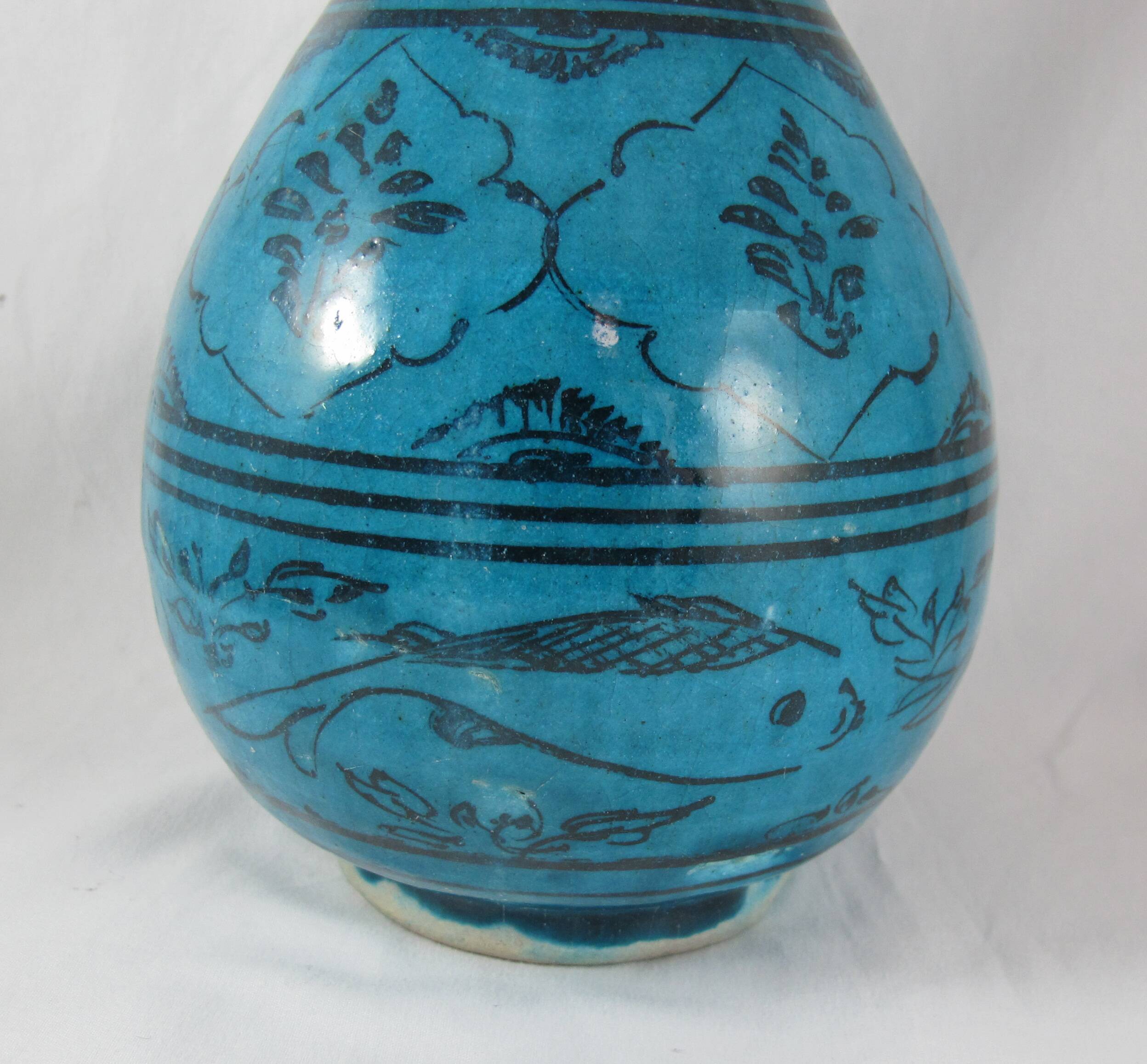 Islamic ceramic vase with turquoise background