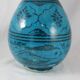 Islamic ceramic vase with turquoise background