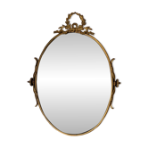 Miroir ovale biseauté en bronze doré