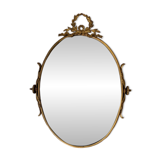 Miroir ovale biseauté en bronze doré
