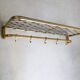 Fifties coat rack with brass net hat shelf