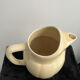 Ivory ceramic jug "La Sté Uzienne"