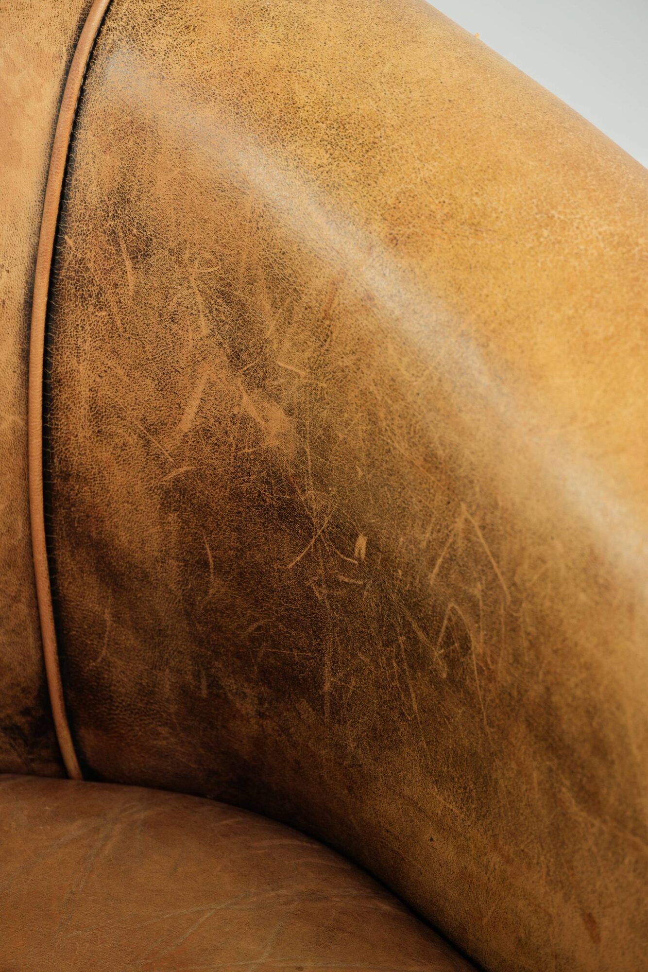 Vintage sheepskin club armchair in a light cognac colour