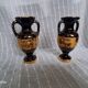 Pair of vases in ancient Greek style gilded with 24-carat gold.
