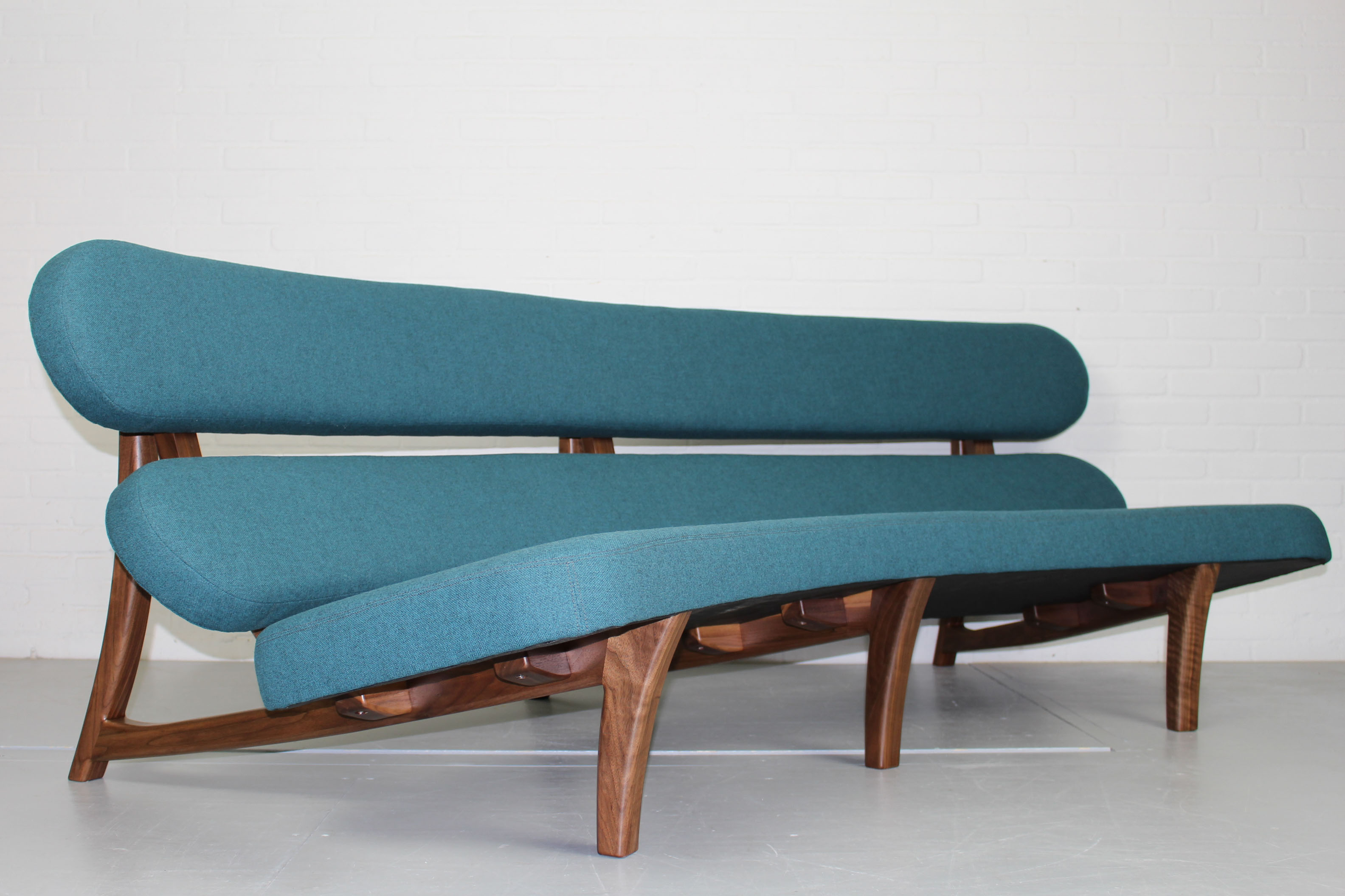 Curved sculptural floating 3-seater sofa dutch design