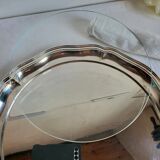 Round silver-plated serving dish with a glass base.