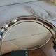 Round silver-plated serving dish with a glass base.