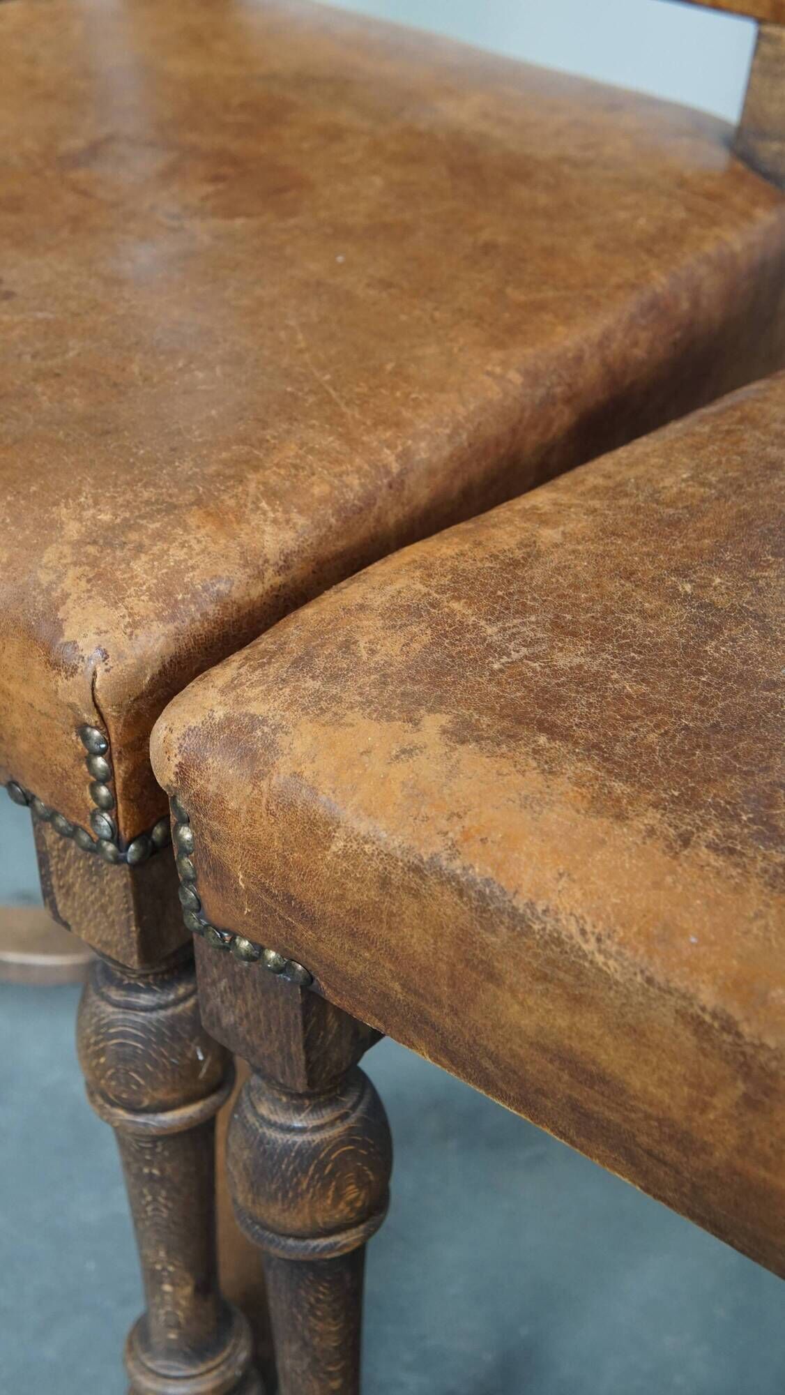 Set of 4 antique wooden and sheepskin leather dining chairs