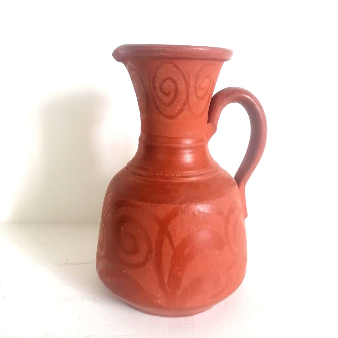 Pitcher in oriental terracotta