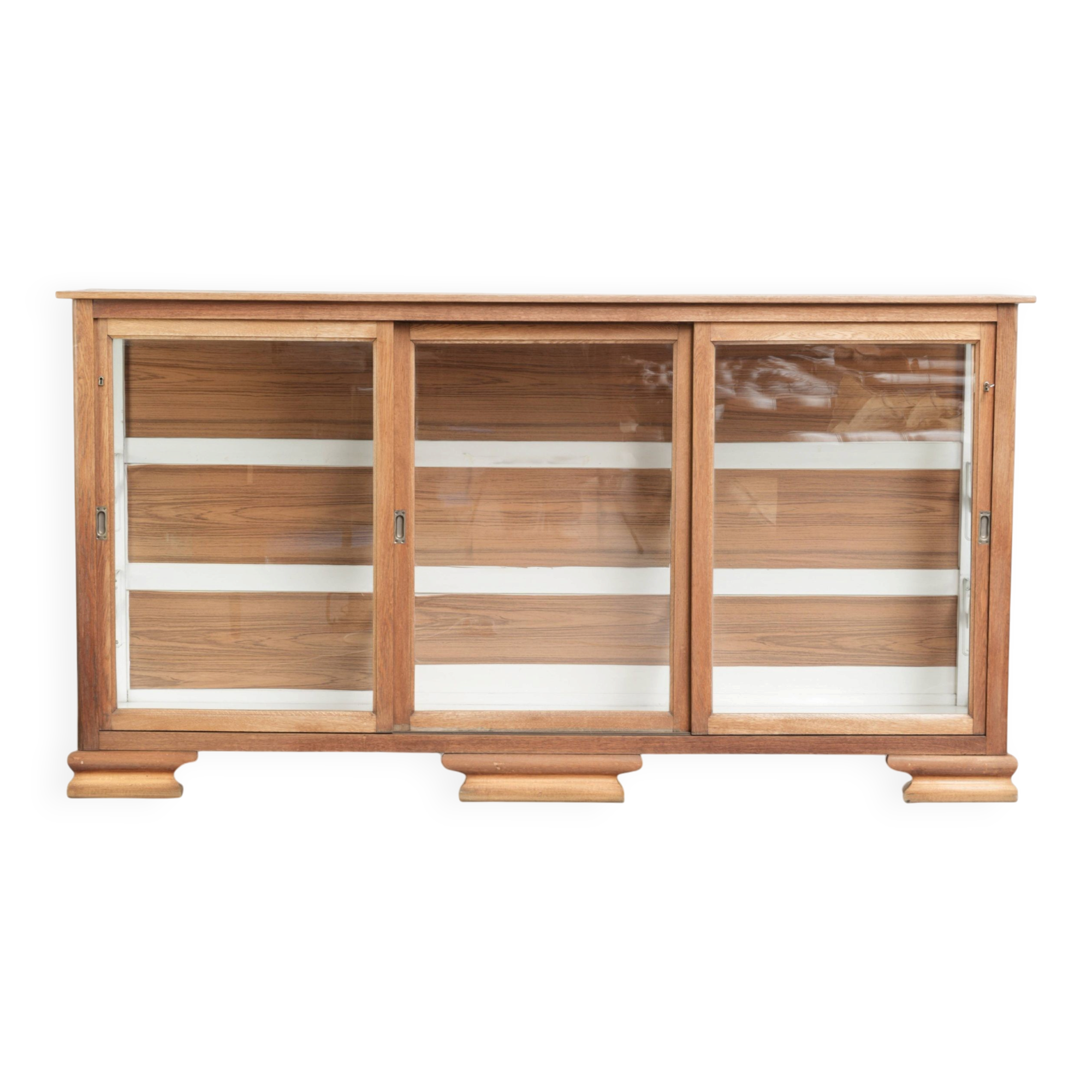 Large antique display cabinet made of oak and equipped with shelves