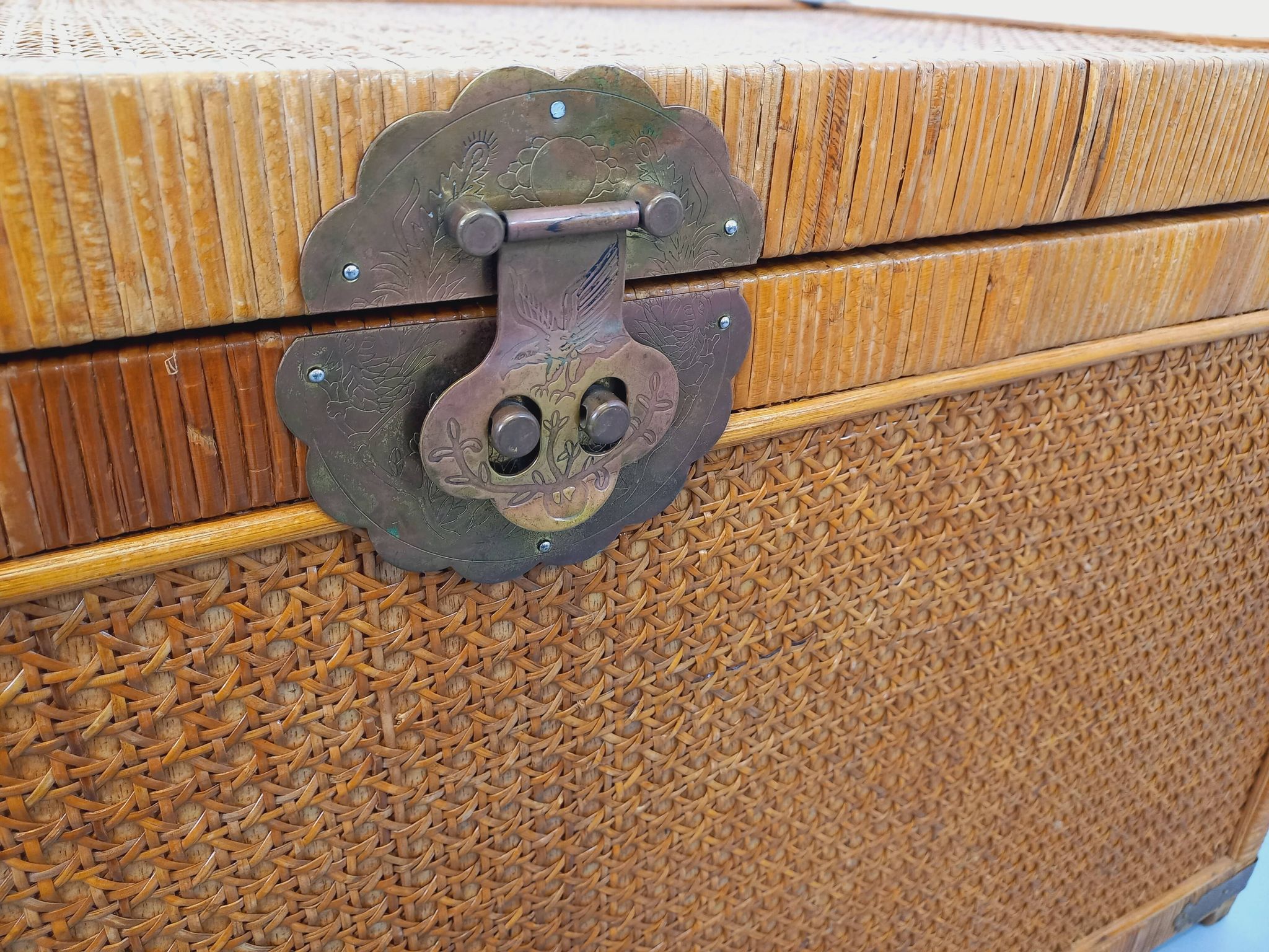 Vintage trunk in wood, rattan, caning, and brass.