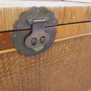 Vintage trunk in wood, rattan, caning, and brass.