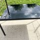 Metal and glass coffee table with magazine rack by Roche Bobois from the 1950s.