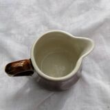 Brown ceramic teapot and milk jugs