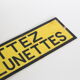 Warning industrial plate "put your glasses"