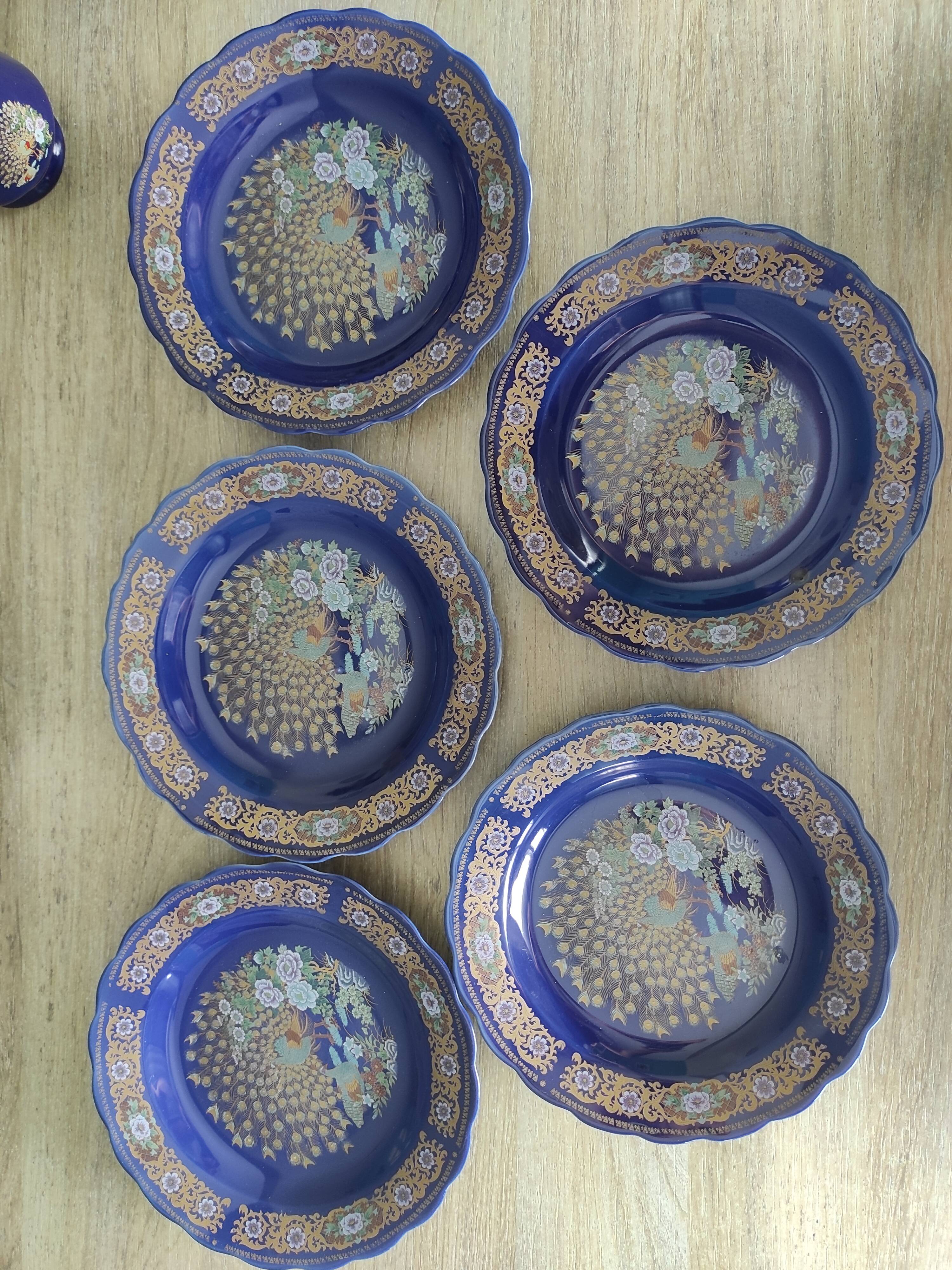 Vintage blue Taous dinnerware set of 21 pieces in very good overall condition.