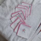 8 Napkins with handmade flower borders.